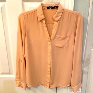 Peach colored long sleeve blouse